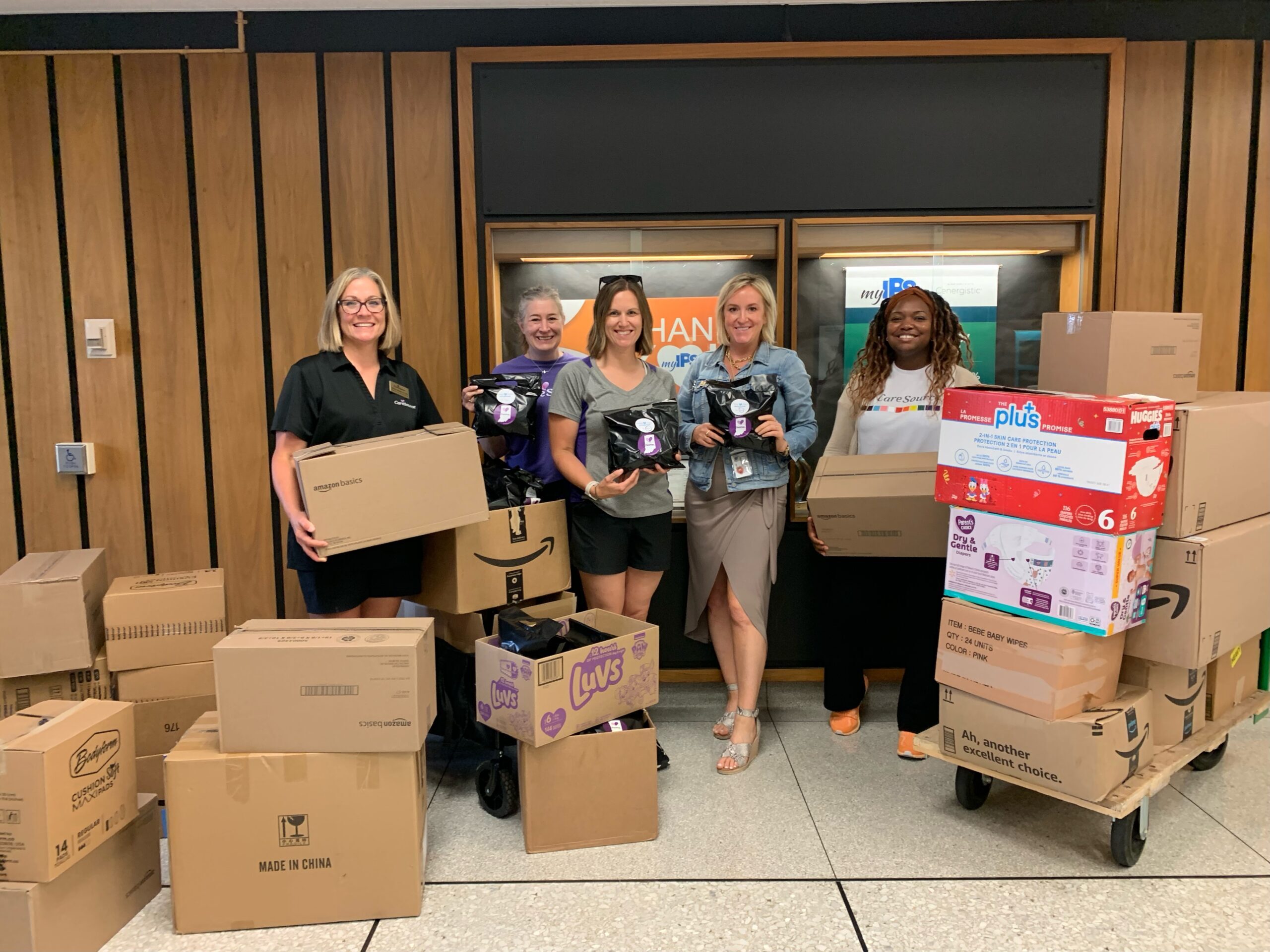 CareSource employees delivering the period packs assembled by CareSource volunteers to the administration offices of Indianapolis Public Schools.